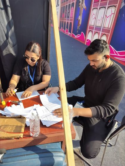 Our team reviewing show documents and schedules backstage. Thorough preparation and paperwork are essential for managing a complex event flow.