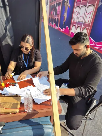 Our team reviewing show documents and schedules backstage. Thorough preparation and paperwork are essential for managing a complex event flow.