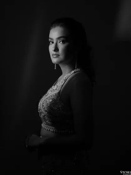 A dramatic black and white profile of the bride, her features beautifully sculpted by the light.