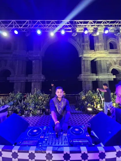 My setup for a sangeet with a stunning Roman-inspired backdrop. I ensure my console area looks clean and professional, fitting in with your event's decor.