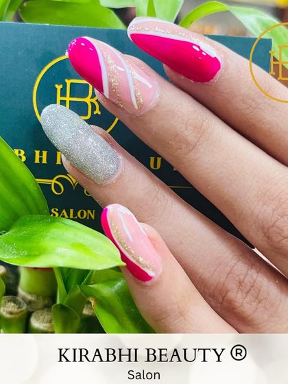 A chic and modern design combining pink, white, and a full silver glitter accent nail. The clean lines and mix of finishes make this look really stand out.