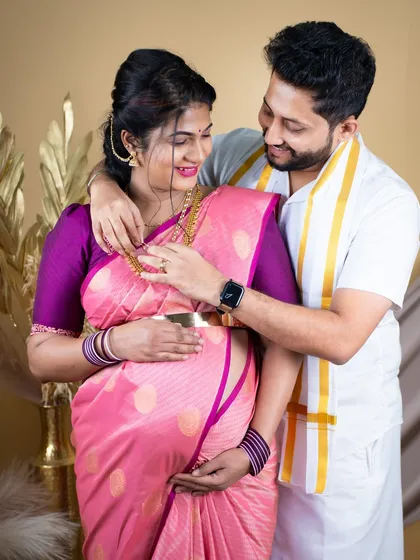 Celebrating your journey with cultural richness is one of our specialties. This traditional saree maternity shoot captures the elegance and beauty of Indian heritage, complete with authentic styling and intimate moments between the couple.