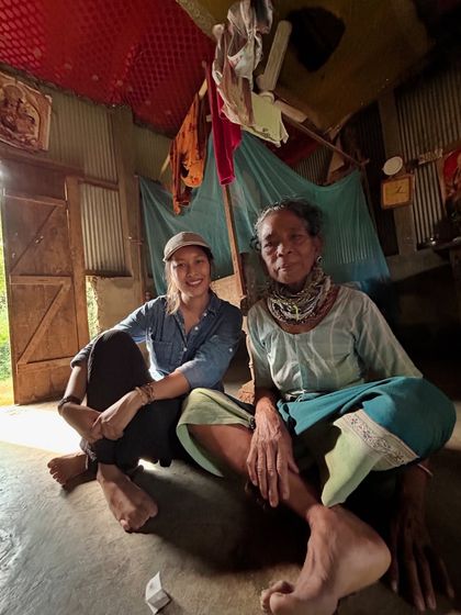 Sitting and talking with an elder in her home. Taking the time to listen and connect is important in both science and music.
