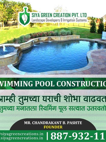 I build pools that enhance the beauty of your home. This freeform pool with a raised spa section and natural stone coping is a great example of how a custom design can transform your outdoor space.