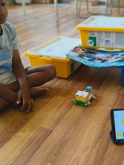 It all starts with an idea. A student at our summer camp works on his LEGO creation, learning to follow instructions and then adding his own creative touch.