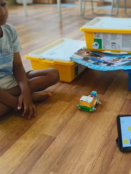 It all starts with an idea. A student at our summer camp works on his LEGO creation, learning to follow instructions and then adding his own creative touch.
