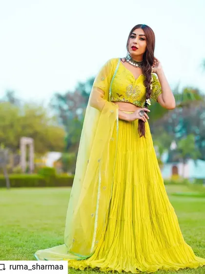 This vibrant lime-green lehenga set is a piece from my Indo-Western fusion collection. I designed it with a finely pleated skirt for beautiful movement and paired it with a hand-embroidered bustier. It’s a fresh, modern take on traditional festive wear, perfect for a mehendi or sangeet.