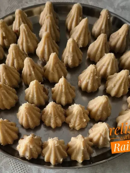 A platter of Rava Modaks made with jaggery. These are made with fine semolina roasted in ghee and flavored with nuts and cardamom.