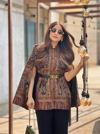 Another look at this handcrafted Kashmiri cape. I've styled it with a simple belt to give it some structure, letting the intricate embroidery be the star.