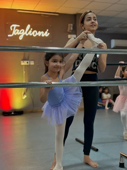 Stretching at the barre is a fundamental part of every ballet class. I love guiding my students as they build the flexibility and strength needed for graceful movements.