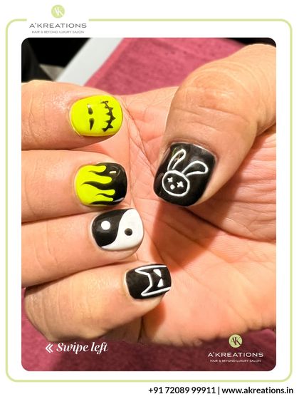 A different angle of our playful graphic nail art, showing off the yin-yang symbol, bunny, and flame designs from another perspective.