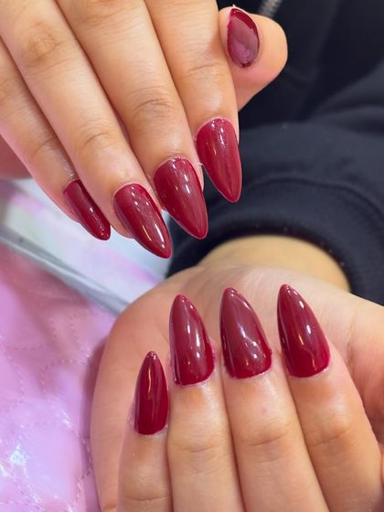 Fierce, bold, and unapologetically classy. This deep red stiletto manicure is the perfect power move, making a statement before you even say a word.