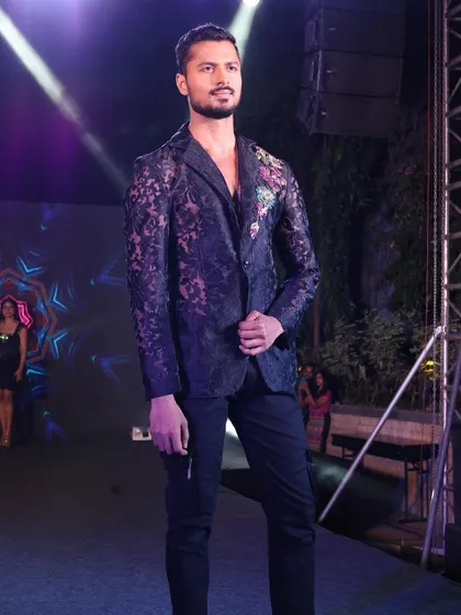 Modeling a sheer lace blazer with floral embroidery for a New Year's Eve event. This look is edgy, festive, and high-fashion.