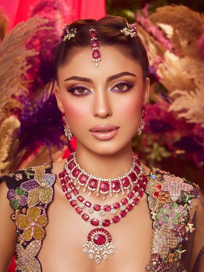 A stunning portrait. The bold purple eye makeup makes a powerful statement, perfect for a bride who wants to stand out.