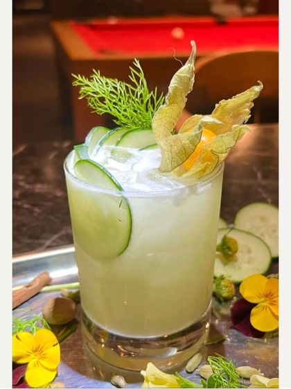 A cool and refreshing cucumber-based mocktail. Garnished with cucumber slices and dill, this is a perfect welcome drink for a daytime event.