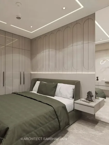 I believe a bedroom should be a sanctuary. Here, I designed seamless, curved wall paneling and integrated wardrobes to create a clean, uncluttered look. The combination of soft, ambient lighting and an earthy color palette makes this room a perfect retreat for rest and rejuvenation.