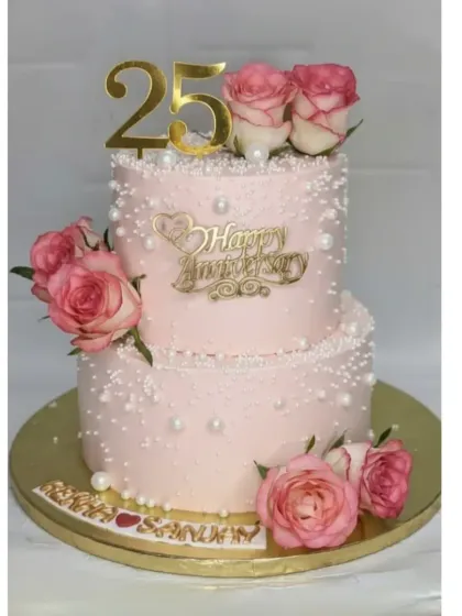 A 25th anniversary deserves something truly special. This two-tiered pearl cake was made with two different flavors, fresh pineapple and chocolate, to please all the guests. It's decorated with fresh roses for an elegant finish.
