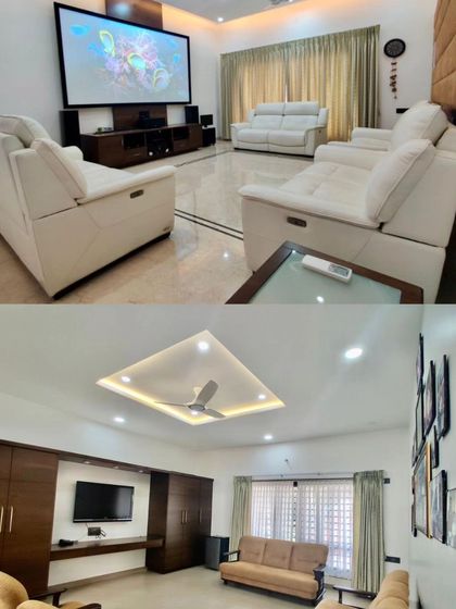 The 'Vijaya Basava' residence includes a dedicated home theater with comfortable recliners, as well as a separate, more casual family room.