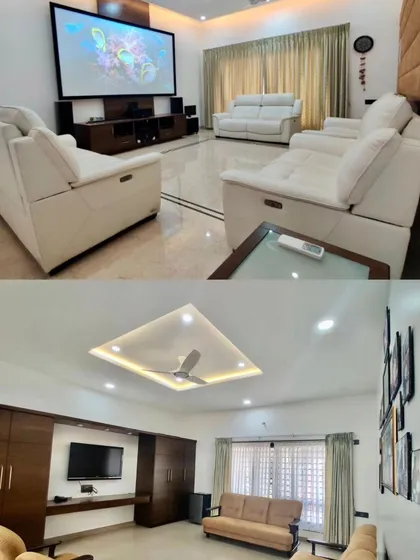 The 'Vijaya Basava' residence includes a dedicated home theater with comfortable recliners, as well as a separate, more casual family room.
