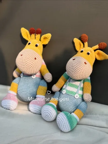 Meet Tinu and Minu, our adorable Amigurumi giraffes. Standing at about 11.5 inches tall, they are meticulously crafted and perfect as nursery decor or a special gift.