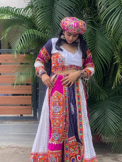 Another take on the Gangubai look, this time with a pink and white color scheme. The pagdi and confident pose make this a truly standout outfit.