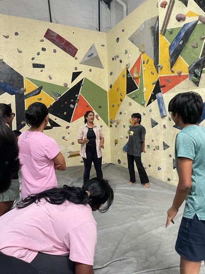 An instructor breaking down a climbing route for the group. Our workshops are designed to be interactive, with plenty of opportunities to ask questions and get personalized tips.