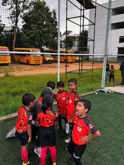 The excitement is real! A young player shouts with joy during a team huddle, capturing the infectious energy of our grassroots teams.