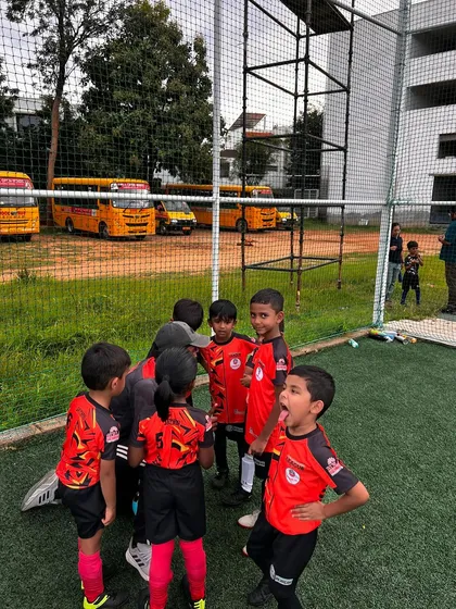 The excitement is real! A young player shouts with joy during a team huddle, capturing the infectious energy of our grassroots teams.