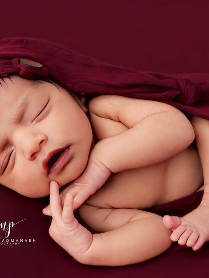 A perfect close-up showing the baby's tiny fingers and lips. Our soft editing style ensures skin tones are natural and beautiful.