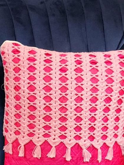 This is another one of my mesh design cushion covers, this time with a bright pink pillow inside. The tassels on the bottom make it look very stylish.