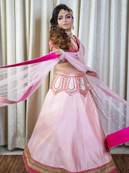 A playful and pretty-in-pink look for an engagement party. The makeup is kept fresh and luminous, with a hairstyle that allows for movement, perfect for a fun-filled celebration.