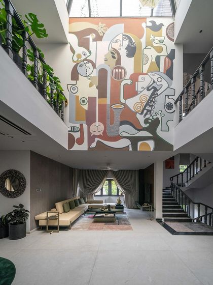 The complete living space, showing how the furniture, lighting, and our mural work together to create a harmonious and story-rich environment.