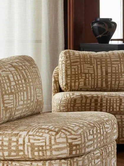 A close-up of the 'Montana' slipper chair's upholstery reveals the rich texture and captivating pattern of the fabric. This level of detail showcases the quality and design integrity of our Nobilis collection.