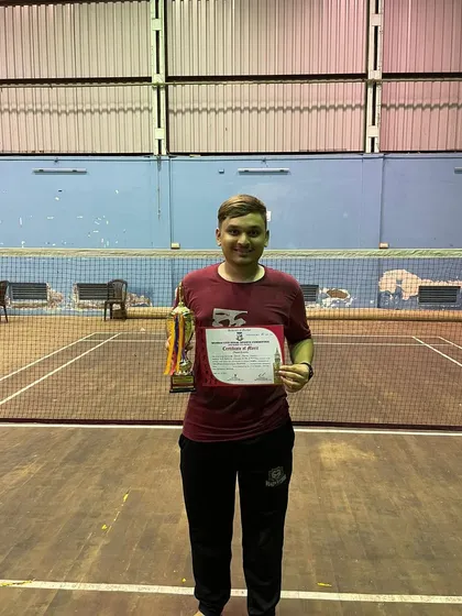 One of our top performers holding his certificate and medal after a strong showing in the Mumbai University Thane zone tournament.