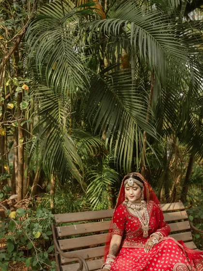A quiet moment of reflection for the bride, seated on a bench in a lush garden. We look for beautiful, serene spots for bridal portraits.