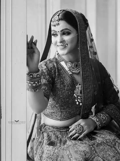 Another black and white shot, capturing the bride's thoughtful expression in natural light.