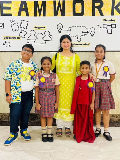 Participants of the "Shakespeare Comes Alive" segment of 'Carpe Diem' pose with a teacher. This activity encourages students to engage with classic literature through dramatic performance.