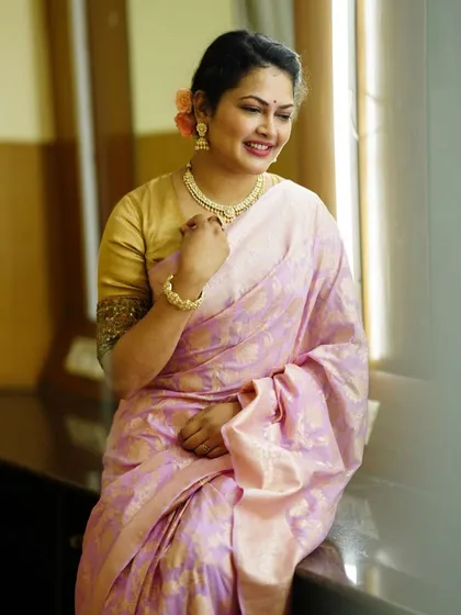 Another shot of the beautiful pink Banarasi saree, showing the intricate weaving and delicate color.
