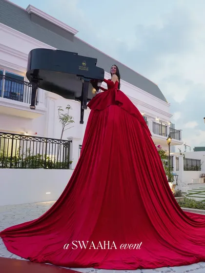 I believe entertainment should be a spectacle. This performer, playing a grand piano from within a flowing crimson gown, is an example of the unique, show-stopping experiences I curate to make your celebration truly extraordinary and leave guests in awe.