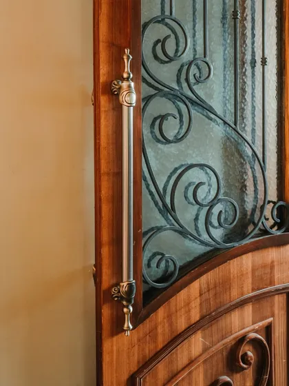 A close-up of the custom door handle, showcasing the intricate metalwork. I believe that luxury is in the details, and elements like this add a tactile and high-quality feel to the overall experience.