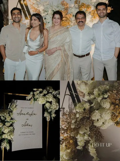 An elegant anniversary celebration with a classic white and gold theme. The decor features a monogrammed floral backdrop, a welcome sign, and happy family moments, all styled with timeless sophistication.