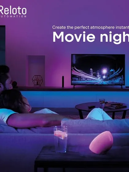 A smart home is about creating the perfect mood for every moment. We design custom lighting scenes that turn an ordinary evening into a special one, like this "Movie Night" setup with ambient backlighting for an immersive experience.