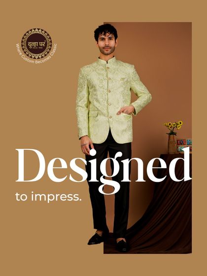 Designed to impress. A model in a light green brocade Bandhgala jacket paired with black trousers. This is a sophisticated look for any formal celebration.