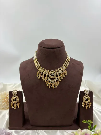 The Royal Hathi Antique Gold Necklace set on display.
