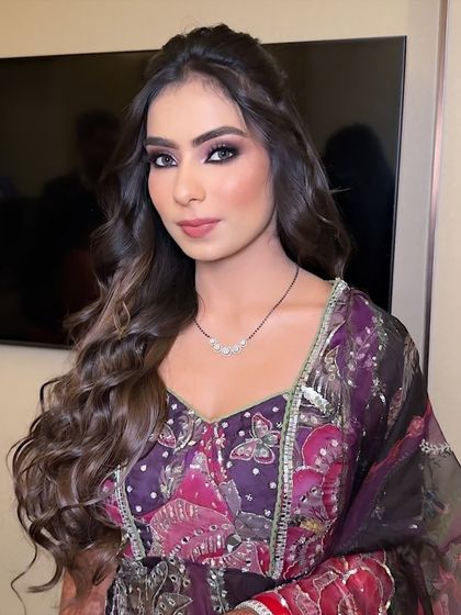 Another angle of this beautiful reception look. The makeup is designed to catch the light and look flawless from every angle.