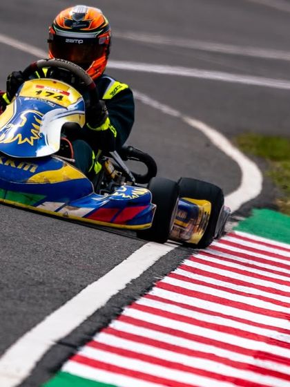 Hitting the apex perfectly at the Meritus Cup. This image shows the technical skill and precision required to be fast and consistent.