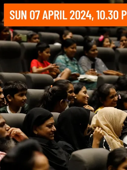 A picture highlighting the date and time for my show, showing a packed and engaged audience.