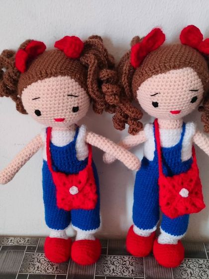Another set of twin dolls, this time in blue jumpsuits with red bags and hair bows. I can customize the colors to make the perfect matching set for you.