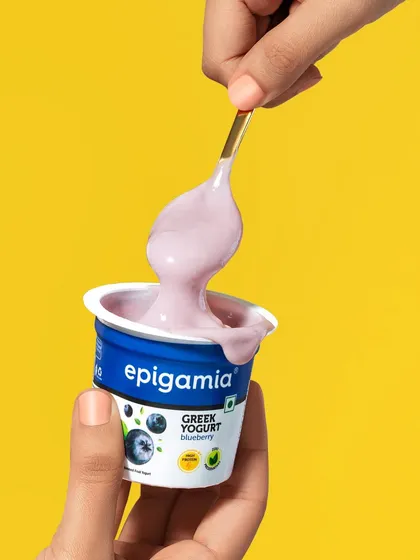 This image for Epigamia's blueberry Greek yogurt is all about texture. I focused on capturing the thick, creamy consistency as it's scooped from the cup, set against a vibrant yellow background for a pop of color.