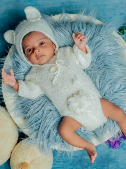 A little bear cub resting on a cloud. I use soft, fluffy textures and a cool blue color palette to create a serene and dreamy atmosphere for your baby's photos.